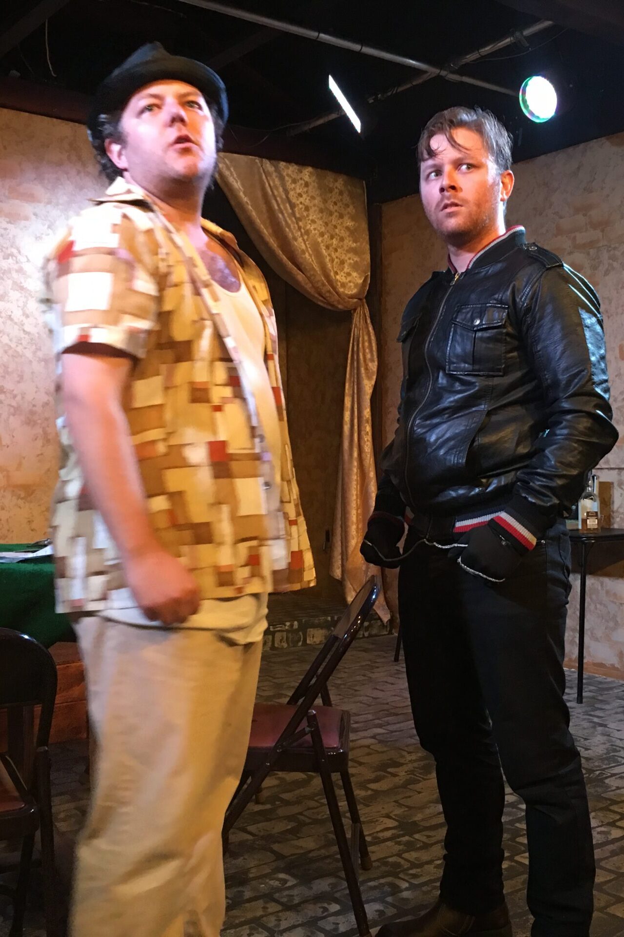 Two men performing on theater stage